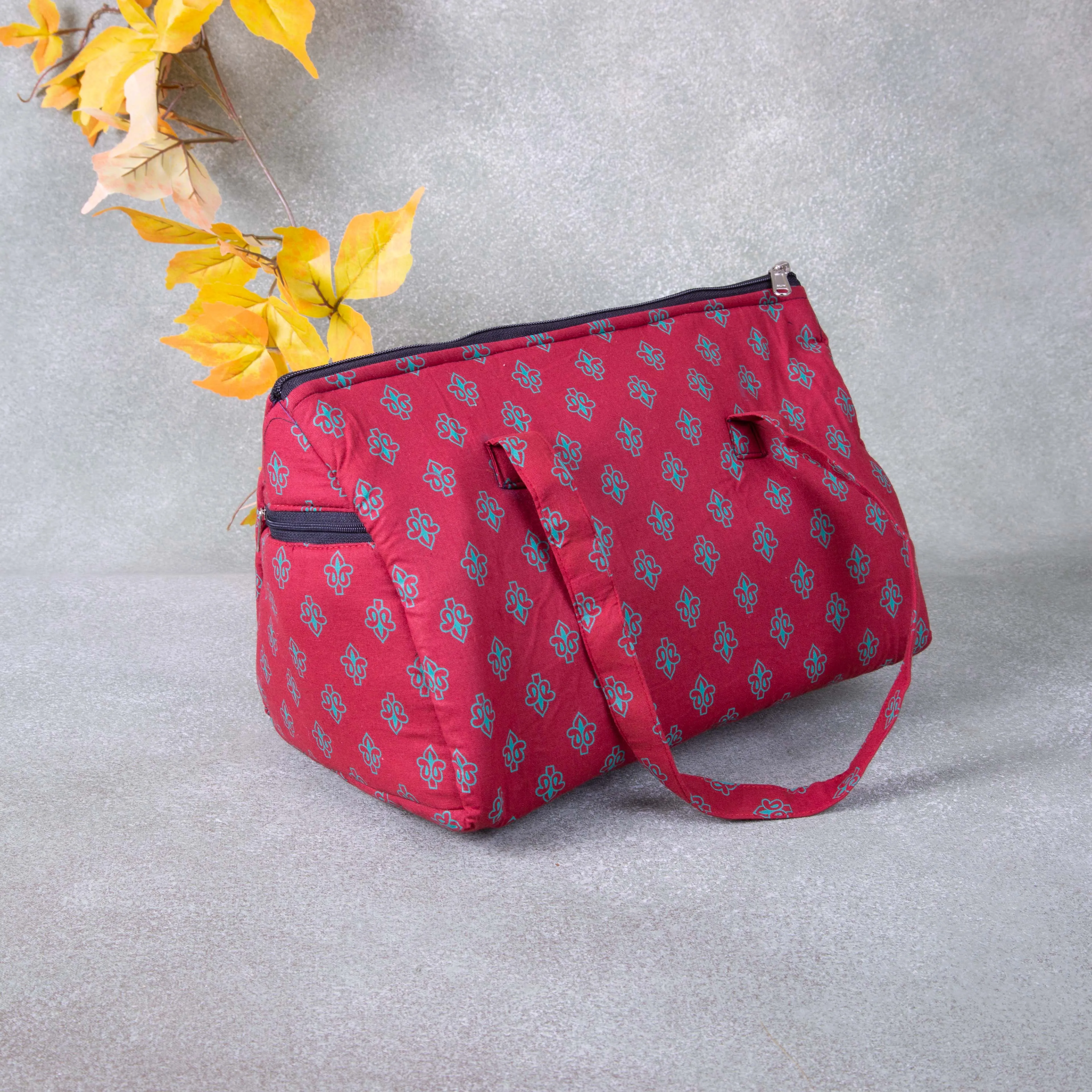 Barrel Handbags Red Colour with Small Green Colour Flower Design.